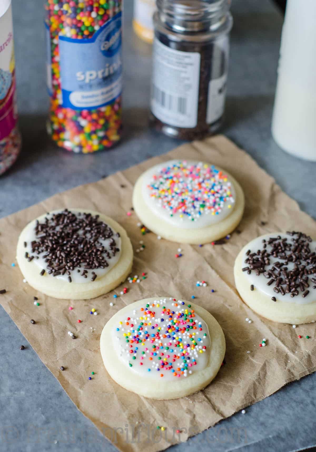 cut-out sugar cookies with icing and sprinkles