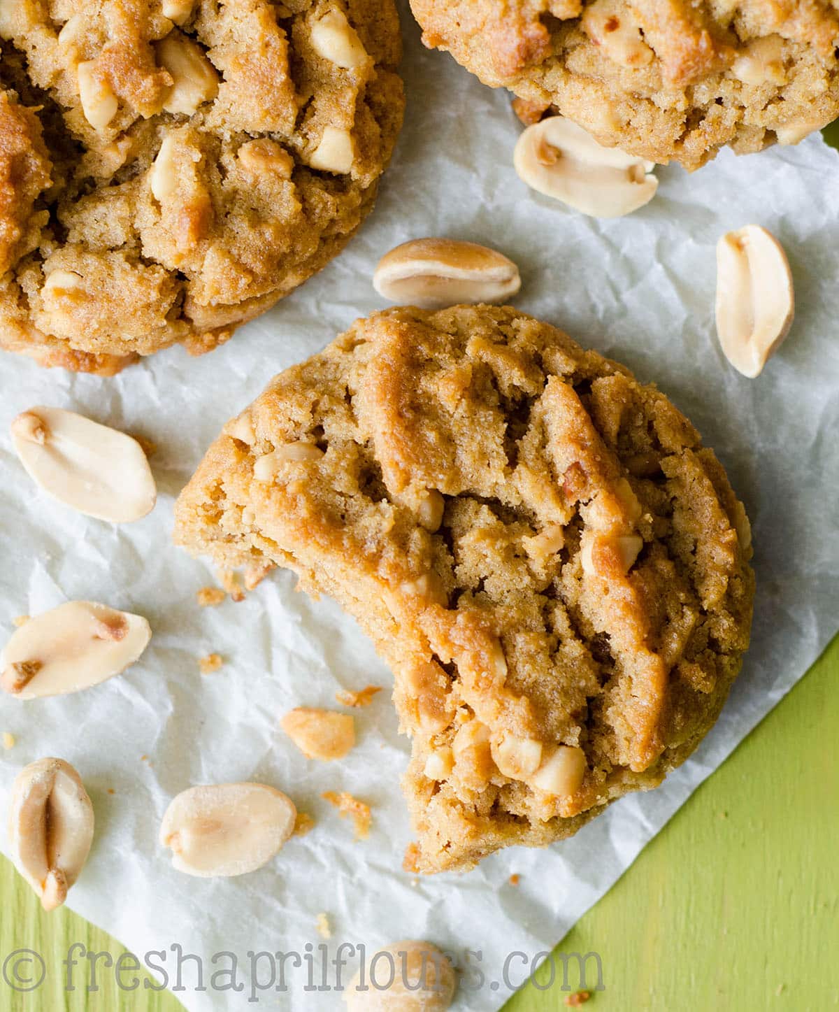 Gluten Free Flourless Crunchy Peanut Butter Cookie with a bite taken out of it.