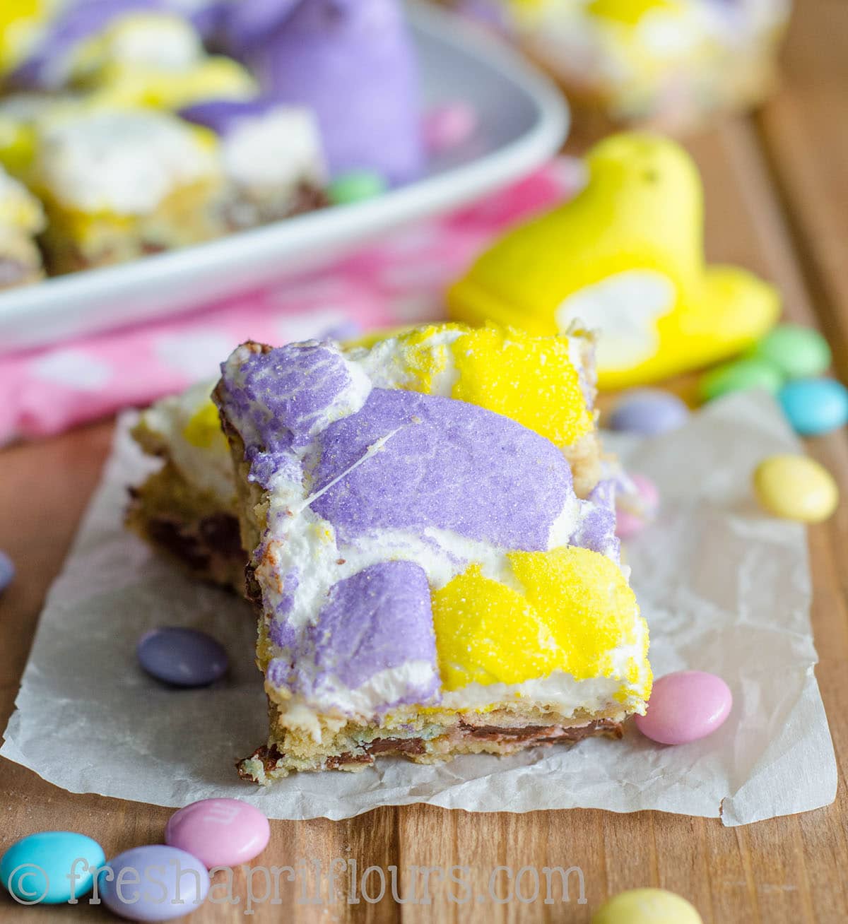 Peeps blondies on a piece of parchment paper. 