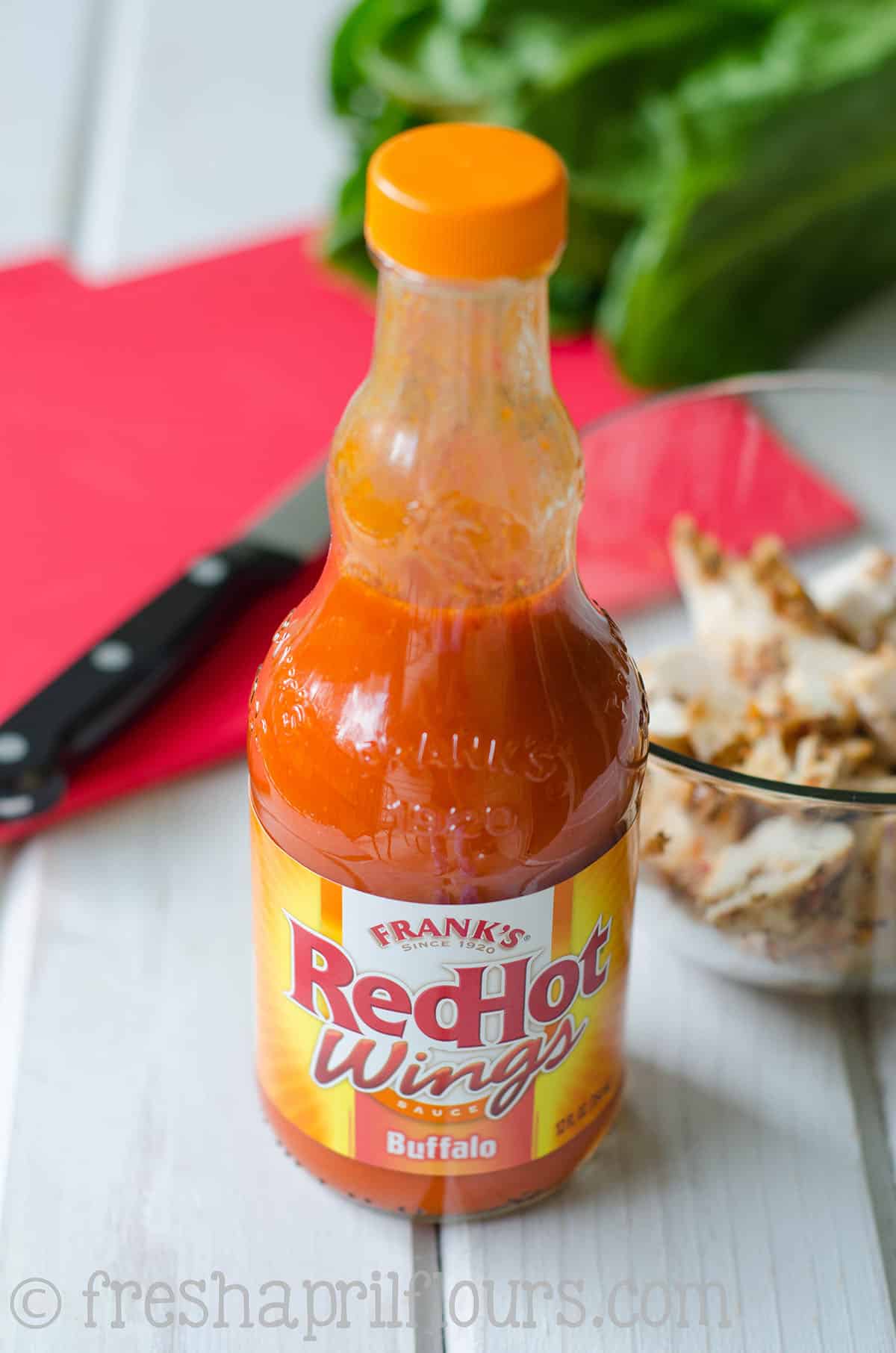 A bottle of Franks RedHot wing sauce.
