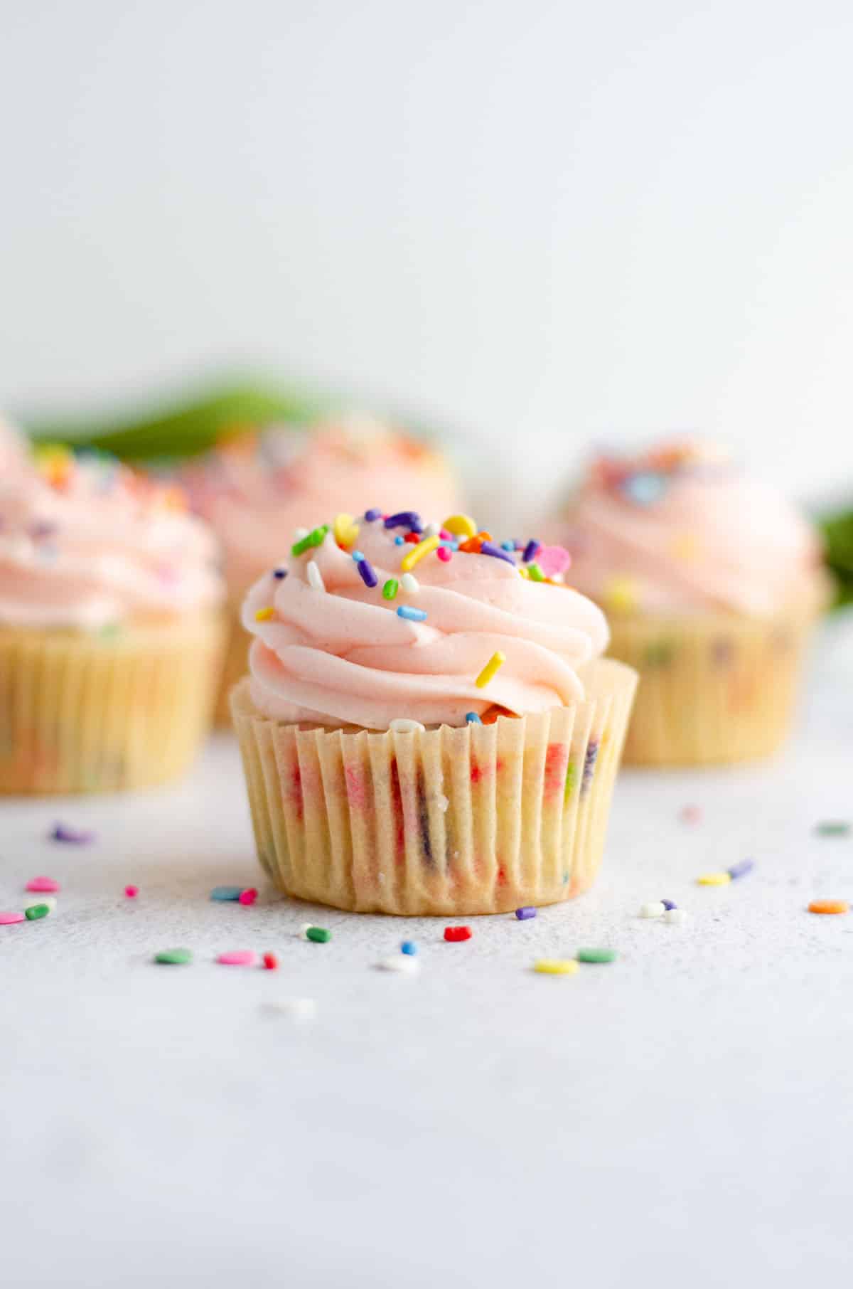 homemade funfetti cupcake with pink frosting