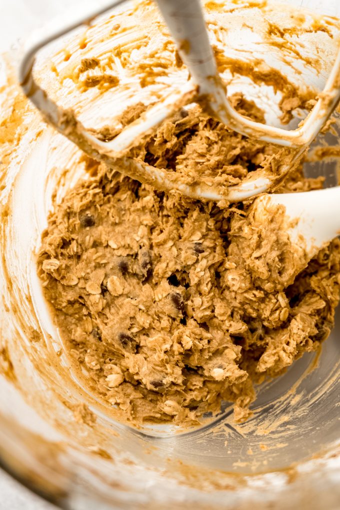 Oatmeal Raisinet cookie dough in the bowl of a stand mixer.