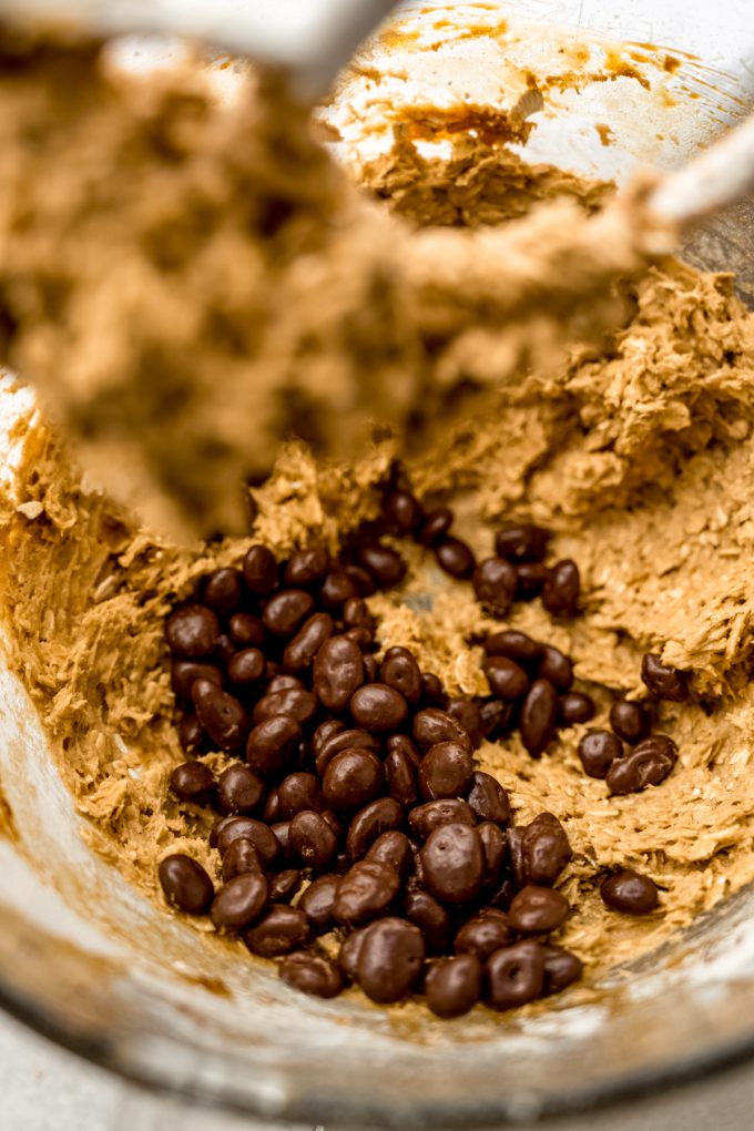 Oatmeal Raisinet cookie dough in the bowl of a stand mixer.