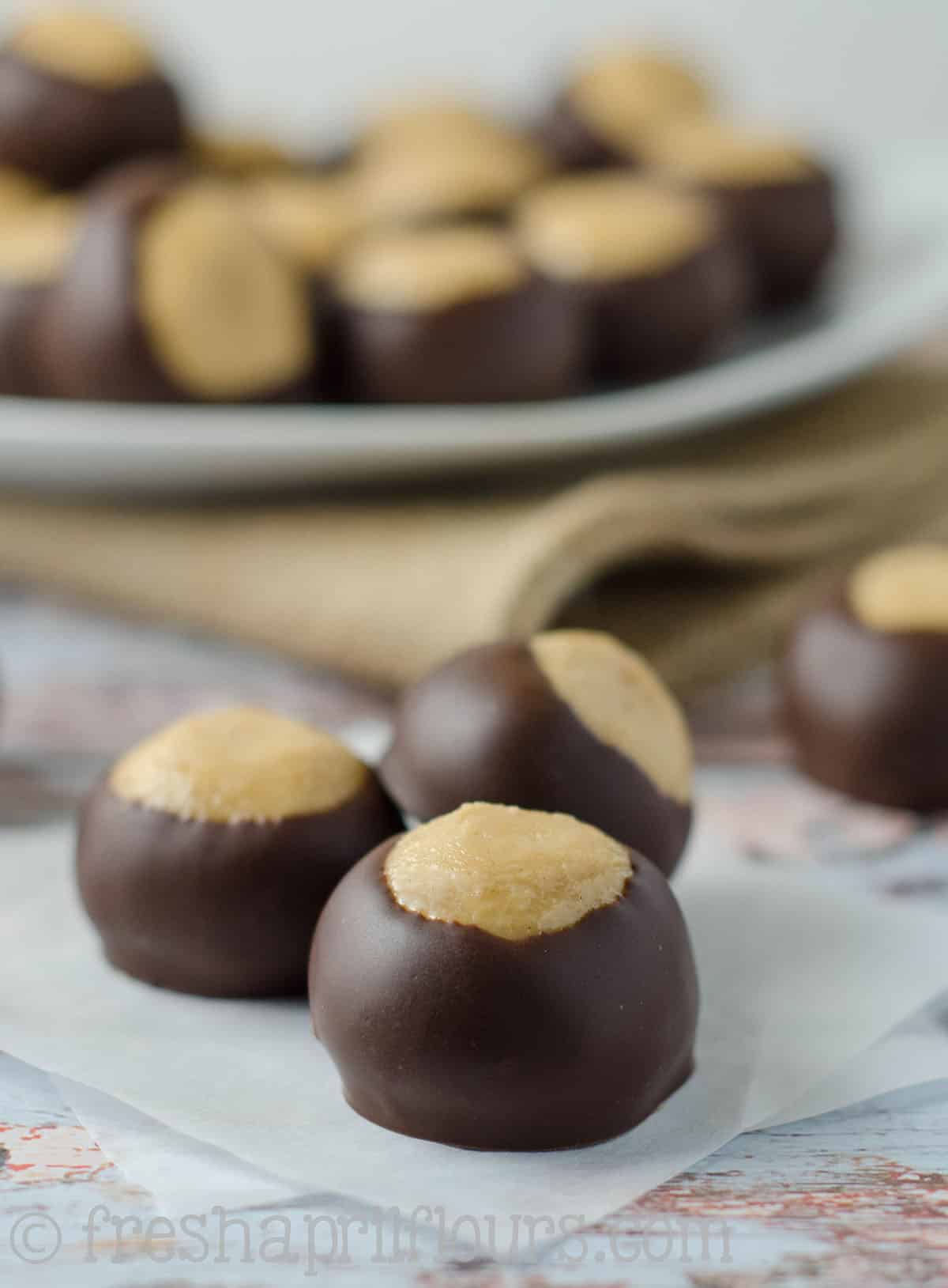 buckeye candies on a parchment square