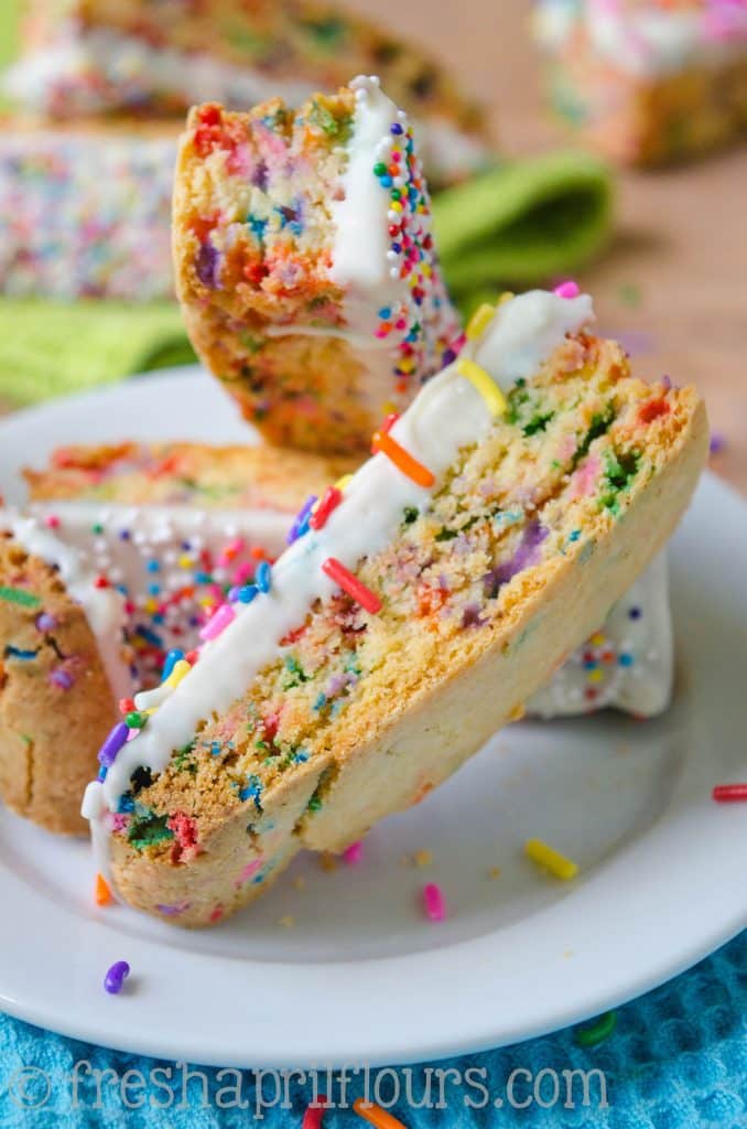 Funfetti Biscotti: Crunchy biscotti filled with sprinkles and dipped in white chocolate, perfect for dunking in coffee. A party in your mouth and your mug!