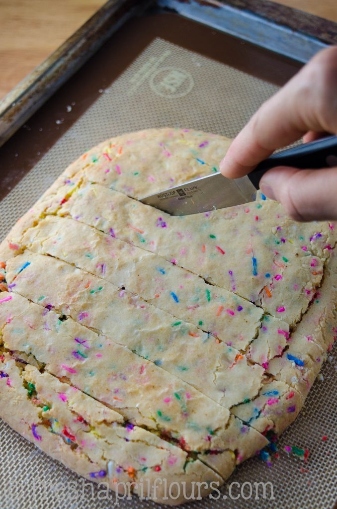 Funfetti Biscotti: Crunchy biscotti filled with sprinkles and dipped in white chocolate, perfect for dunking in coffee. A party in your mouth and your mug!