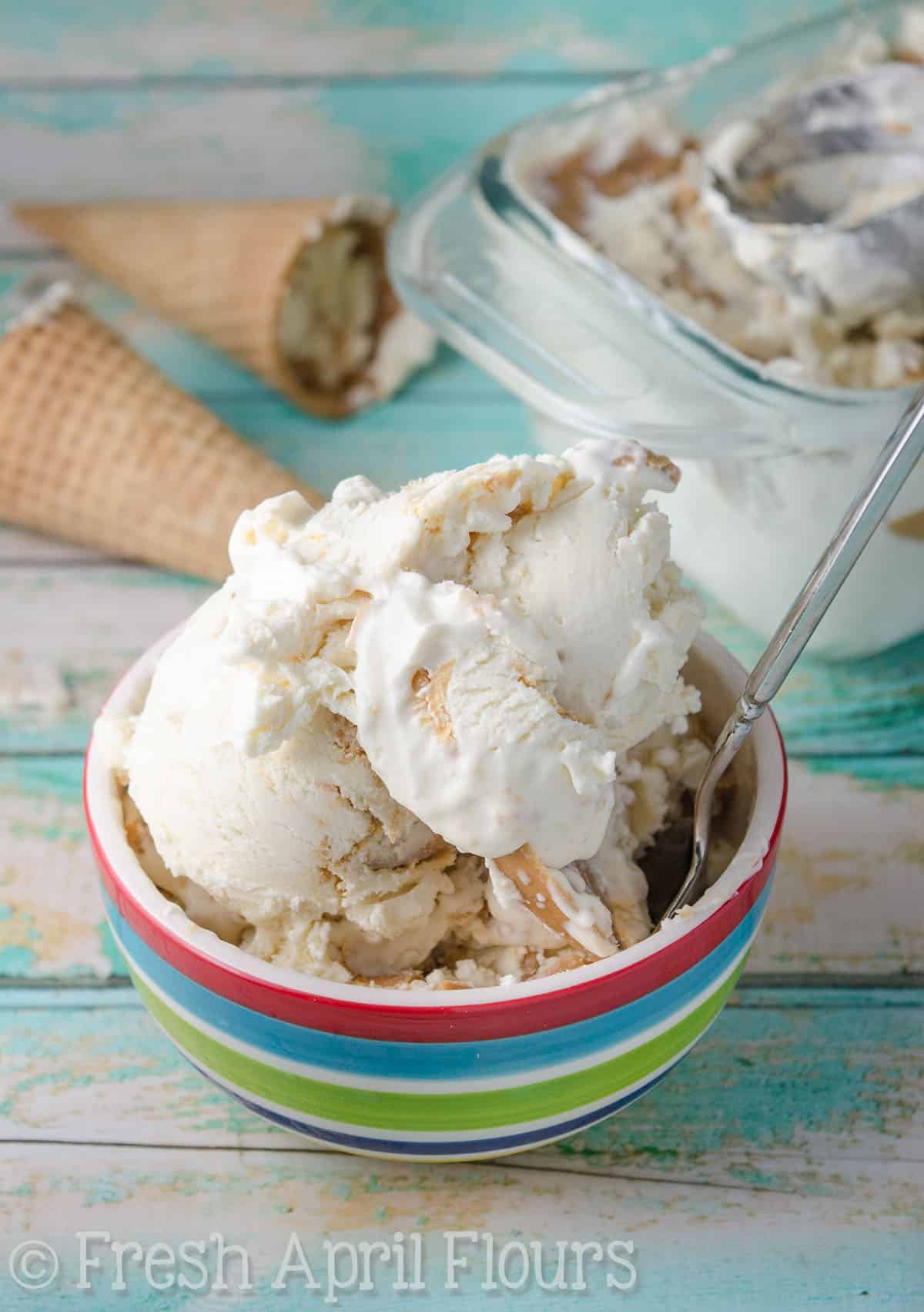 No churn peanut butter ripple ice cream in a colorful bowl with a spoon. 