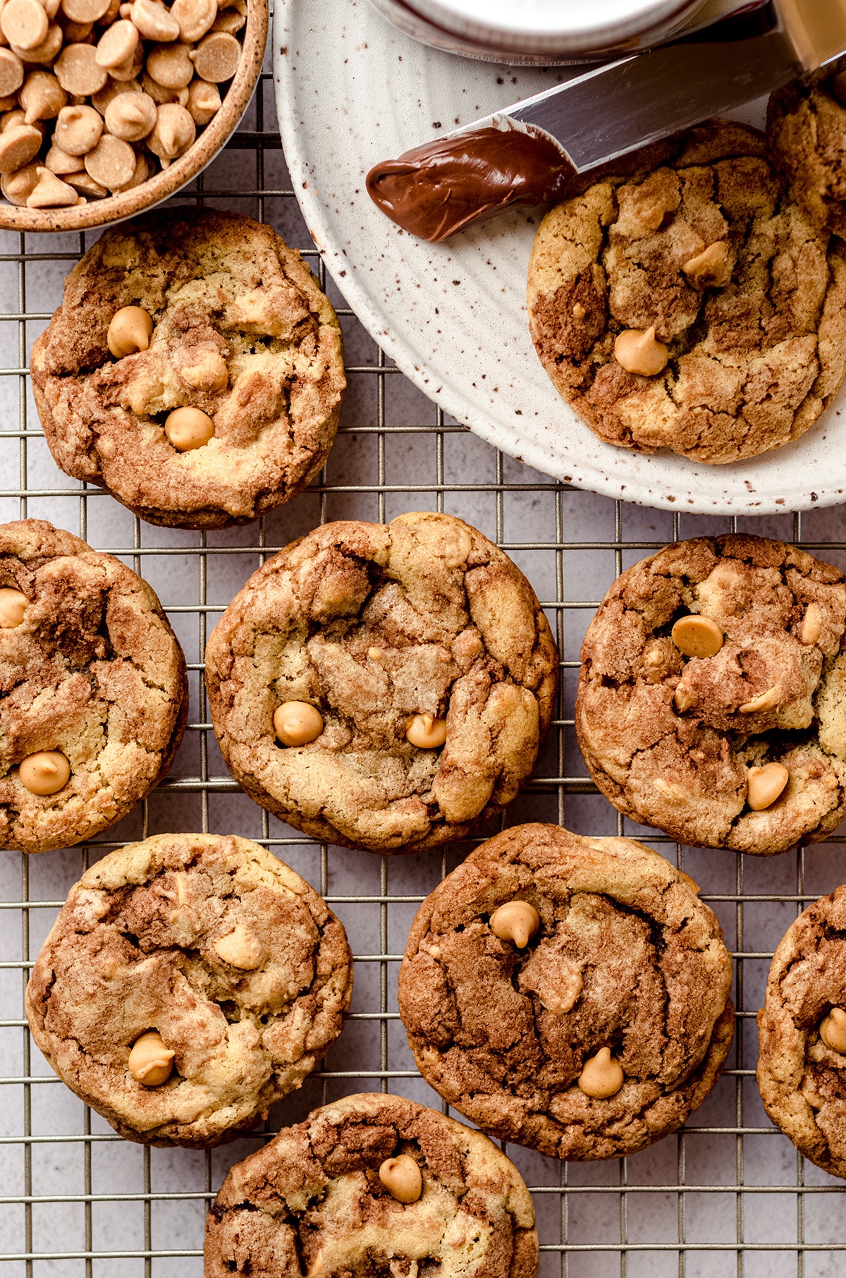 aerial photo of nutella peanut butter chip cookies on a cooling rack