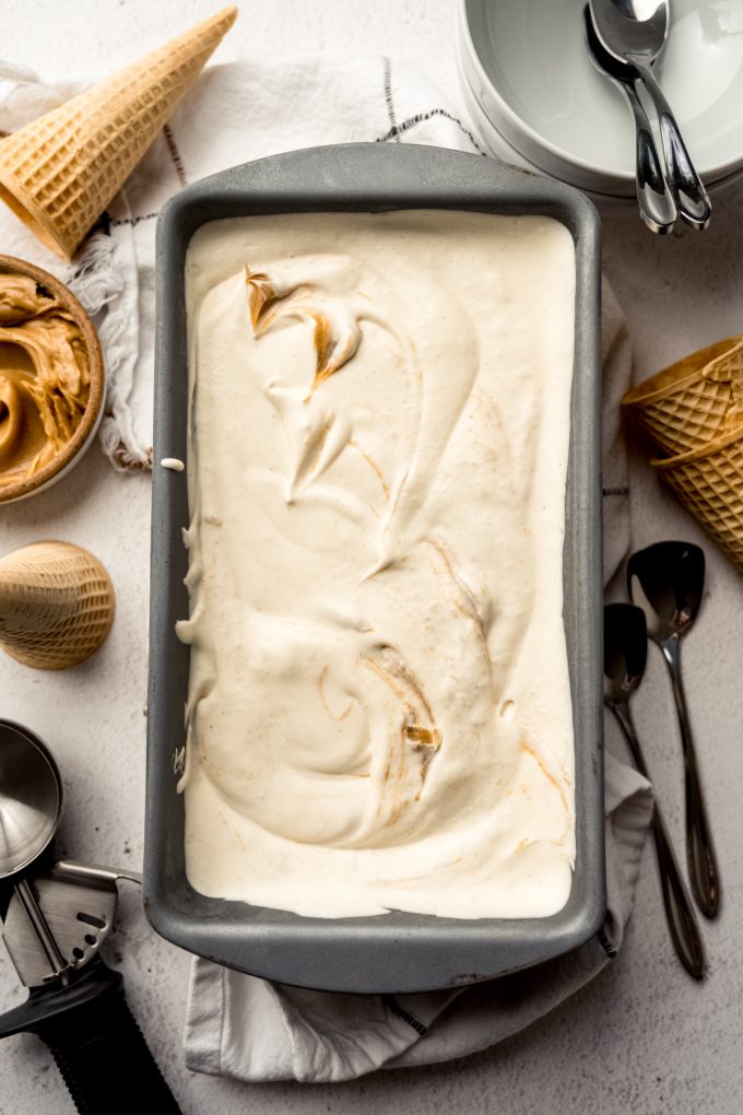Aerial photo of a loaf pan with peanut butter ripple ice cream in it.