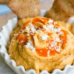 Creamy Buffalo Hummus: Smooth hummus loaded with spices and creamy blue cheese, perfect for dipping with homemade pita chips or your favorite vegetables.