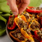 Mini Philly Cheesesteak Stuffed Peppers: Don't let the "mini" part fool you-- these bite-size peppers are packed with tons of flavor! Recipe includes instructions for four large Philly cheesesteak stuffed peppers.