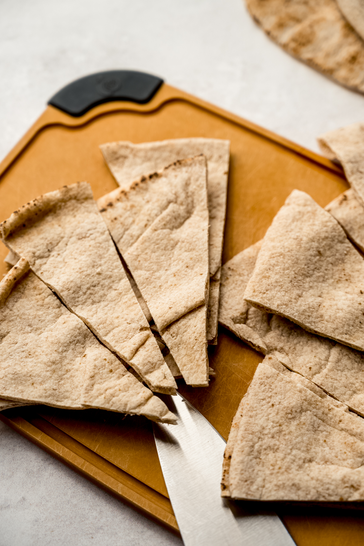 Pitas cut into wedges to make homemade pita chips.