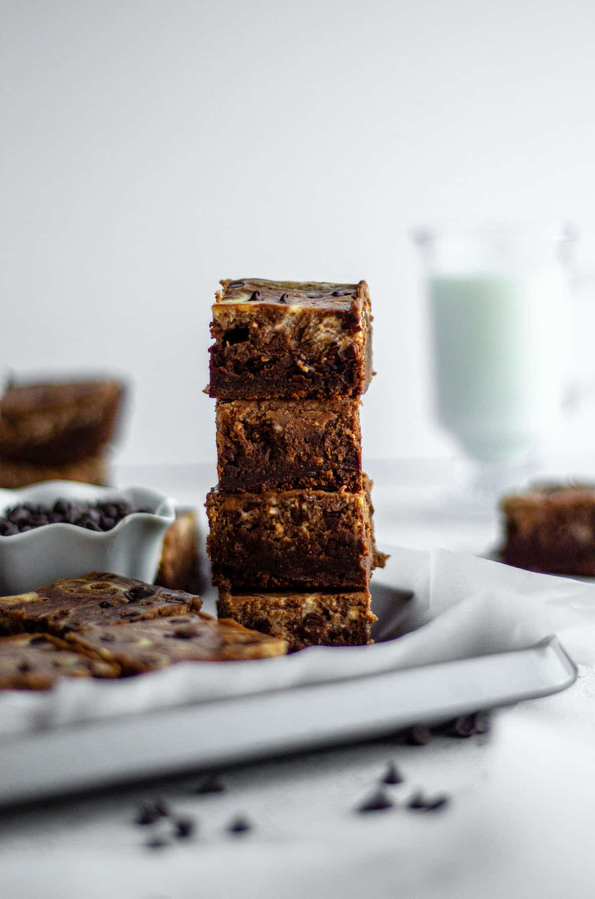 stack of brownies with glass of milk