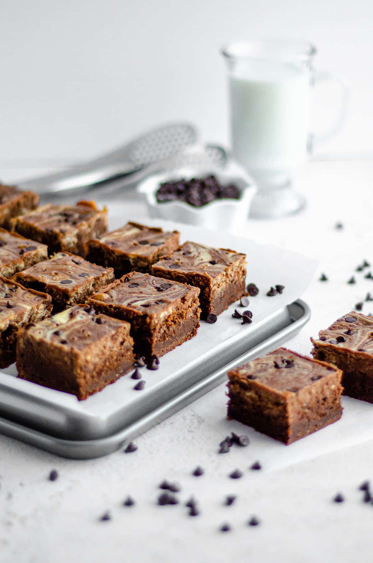 Chocolate Chip Cheesecake Swirl Brownies: Dense and fudgy scratch brownies swirled with sweet chocolate chip cheesecake.