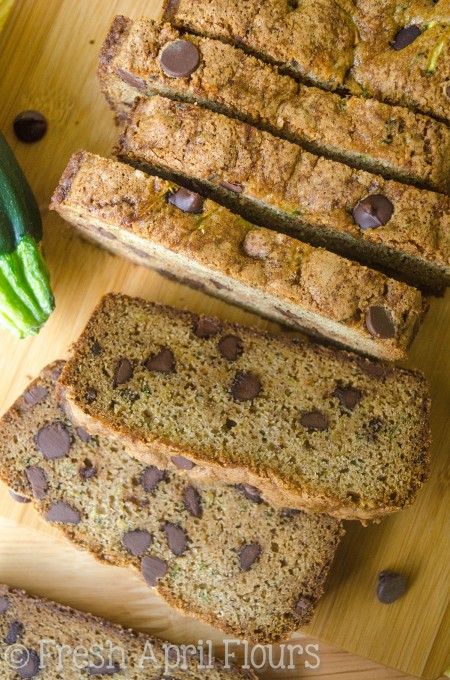 Chocolate Chip Zucchini Bread: Perfectly spiced, perfectly sweetened, and a great way to use up your summer zucchini (or frozen zucchini any time of the year)! Recipe makes one loaf or 12 muffins.