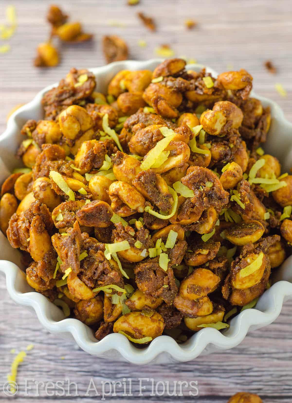 Toasted coconut curry peanuts in a small bowl.