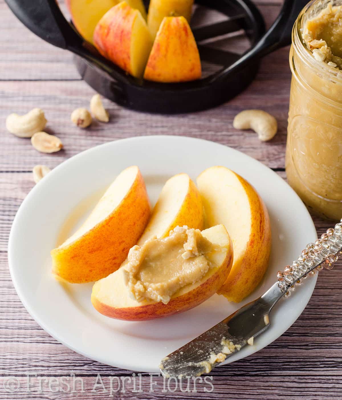 Honey cashew butter spread onto a slice of apple.