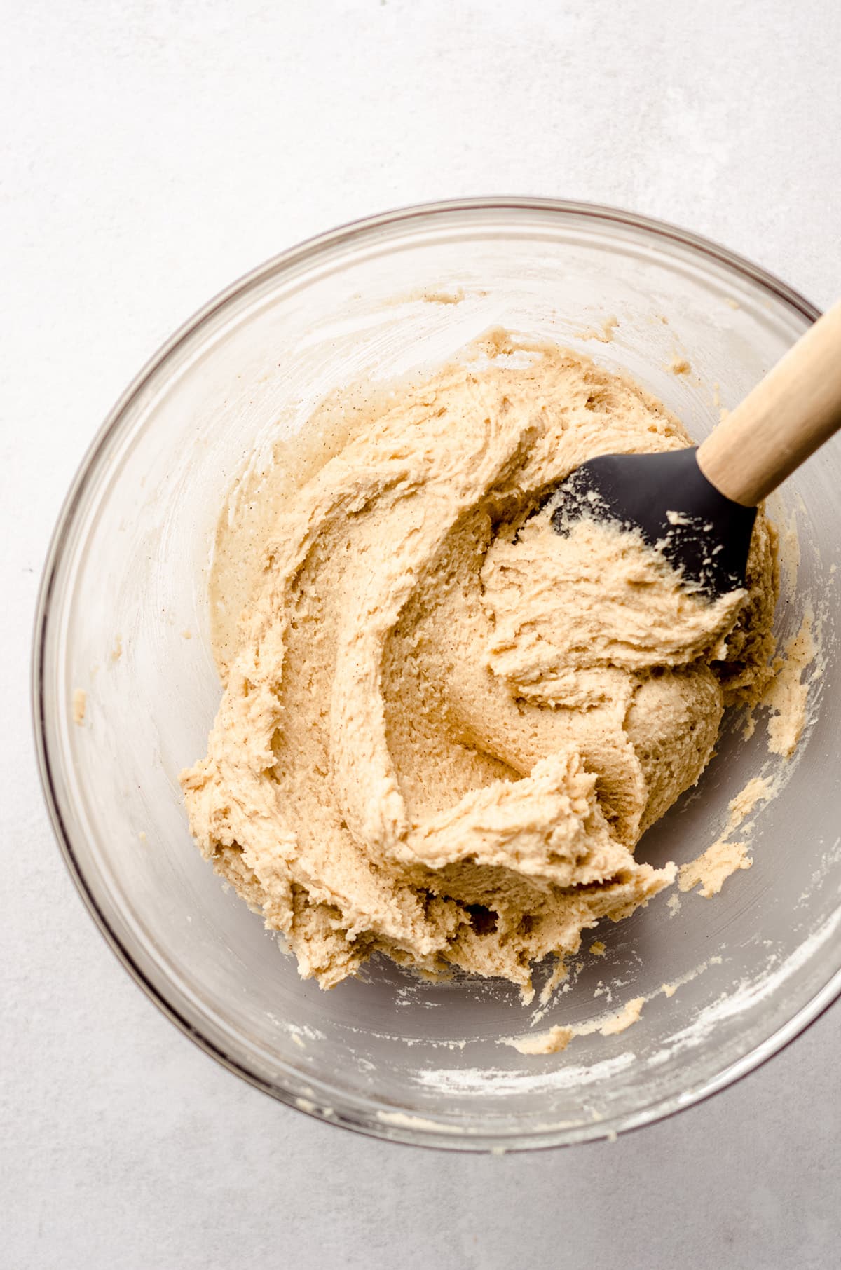 snickerdoodle cookie dough in a glass bowl