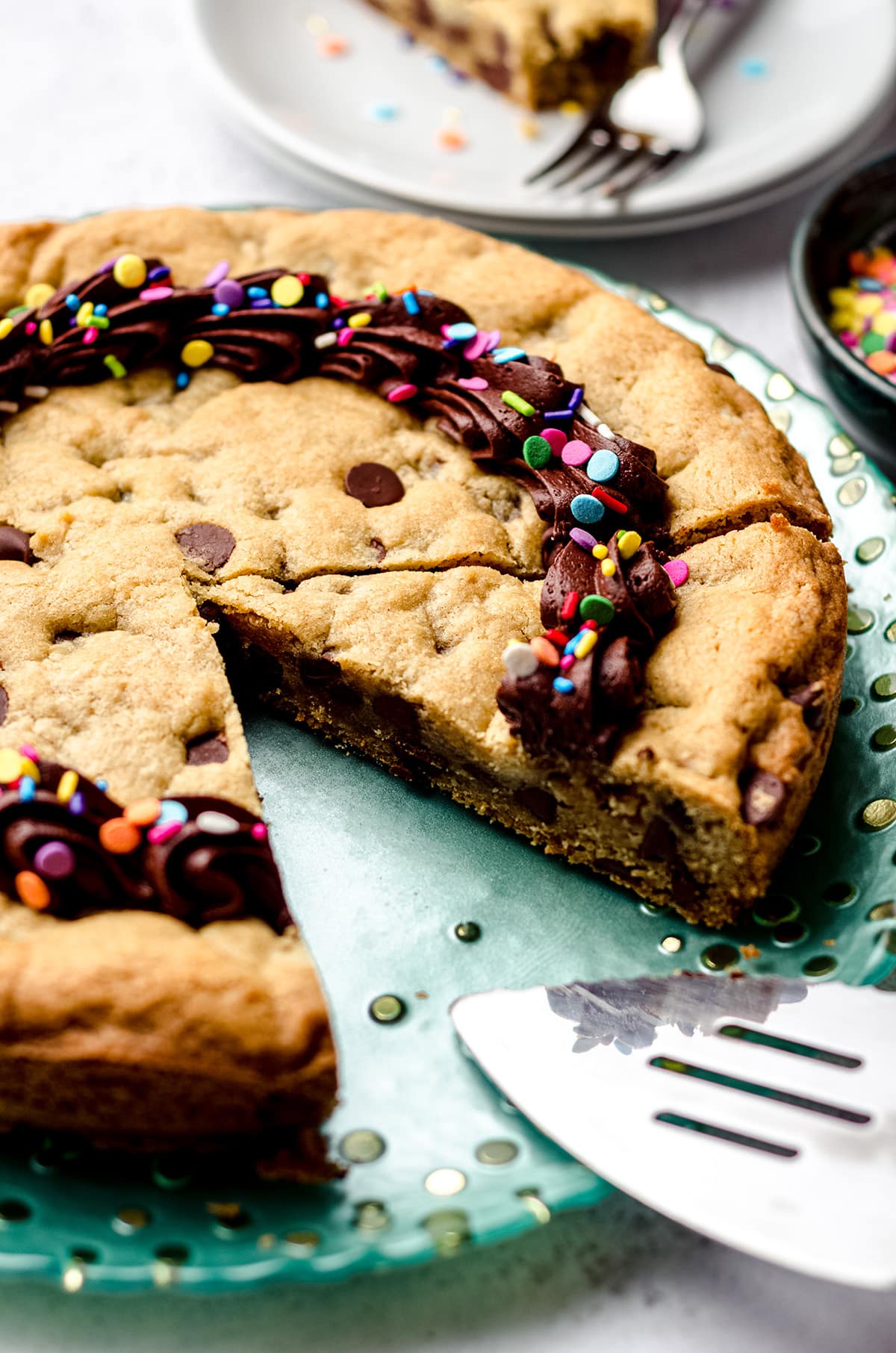 sliced chocolate chip cookie cake on a plate