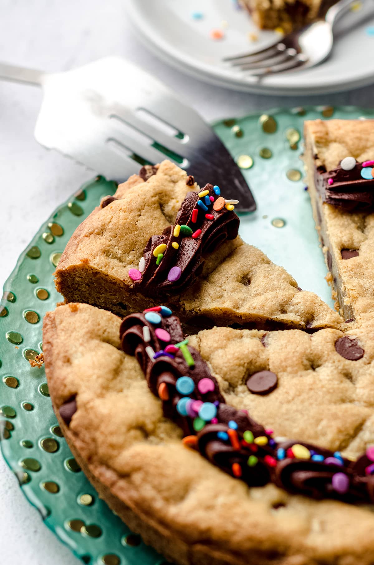 sliced chocolate chip cookie cake on a plate