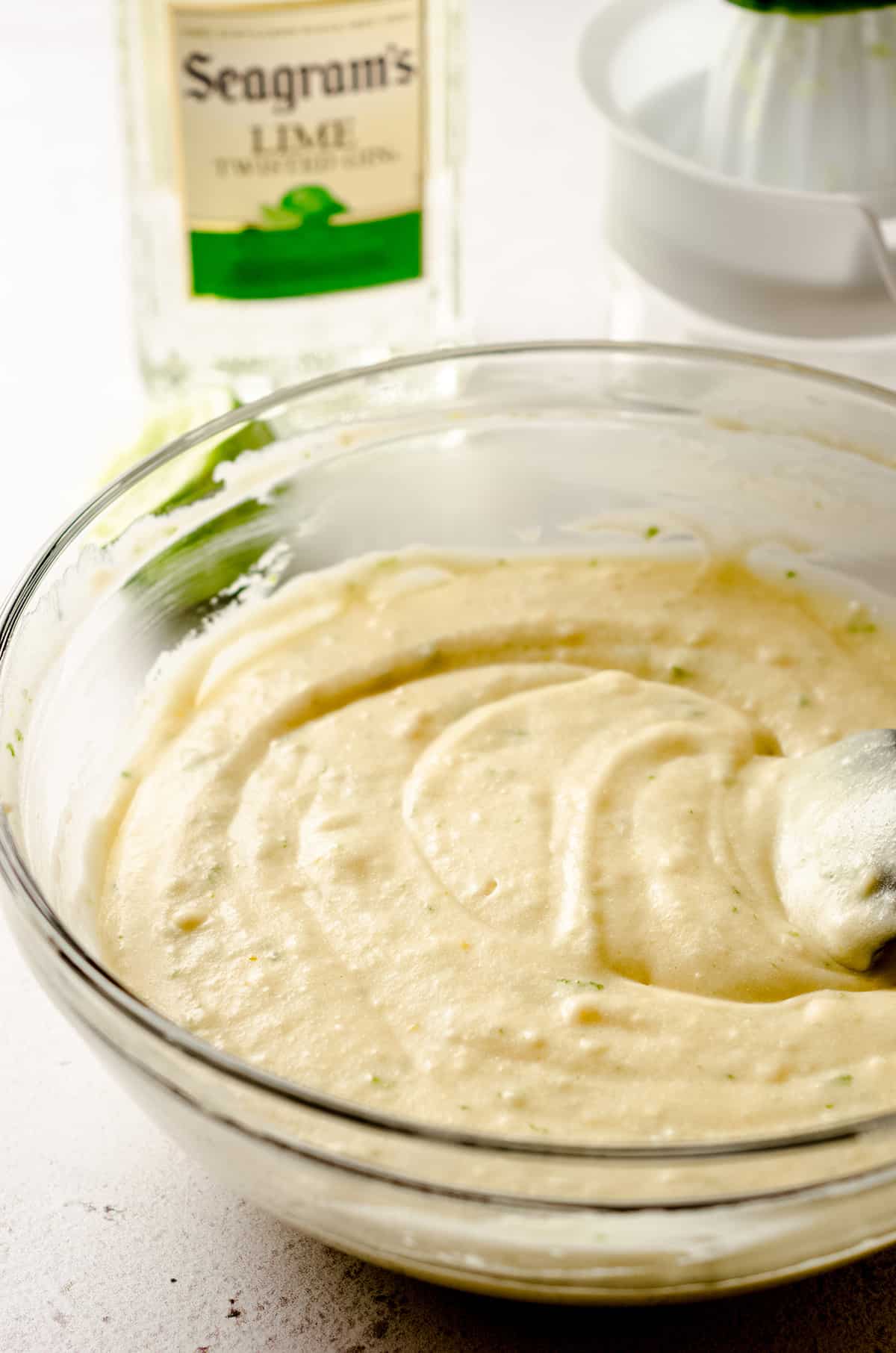 gin and tonic cake batter in a glass bowl