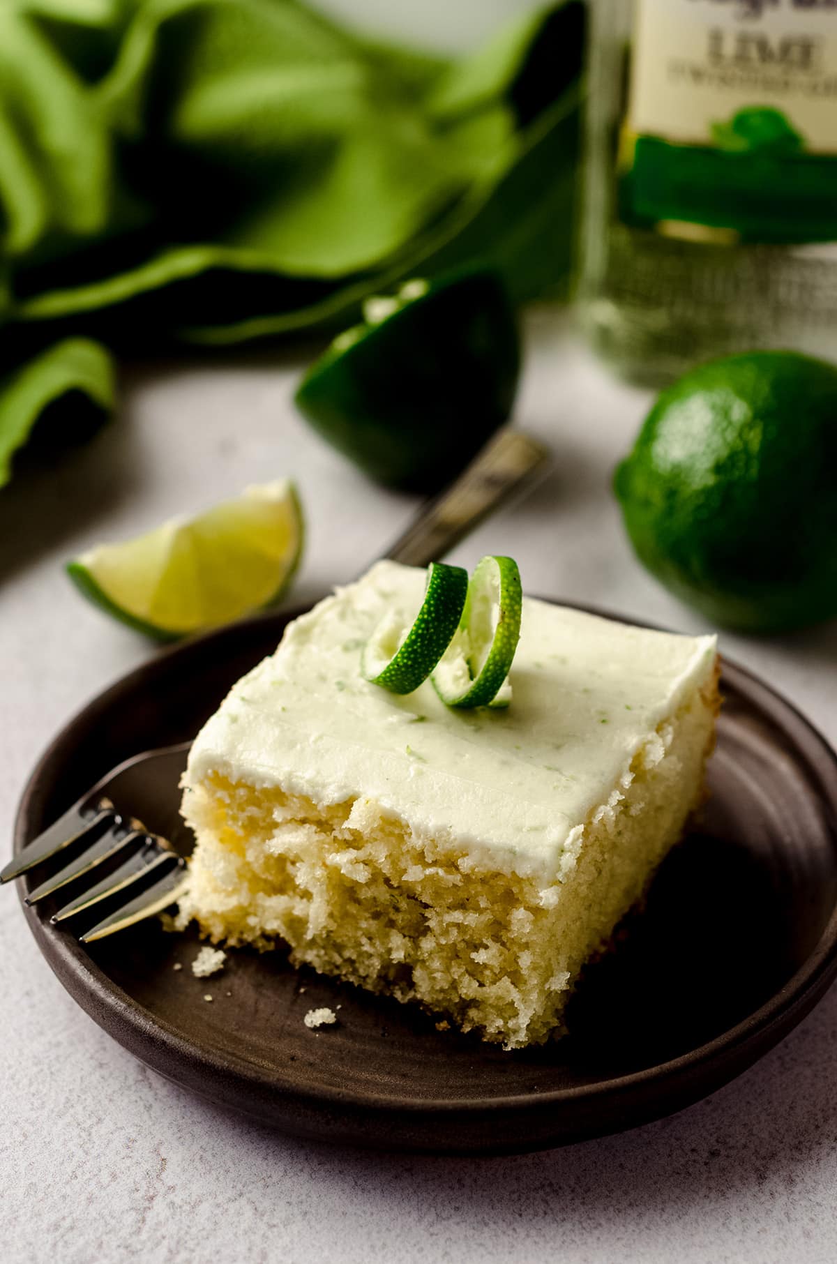 slice of gin and tonic cake sitting on a plate