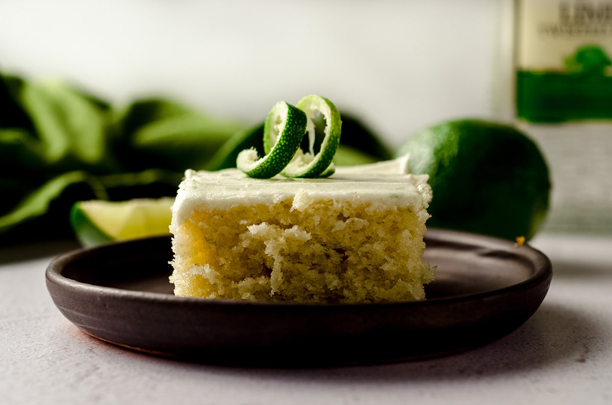 slice of gin and tonic cake sitting on a plate