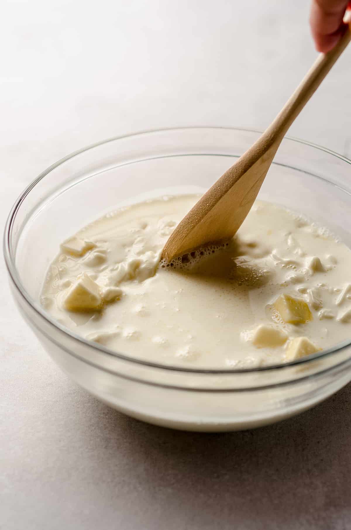 stirring lemon ganache with a spoon