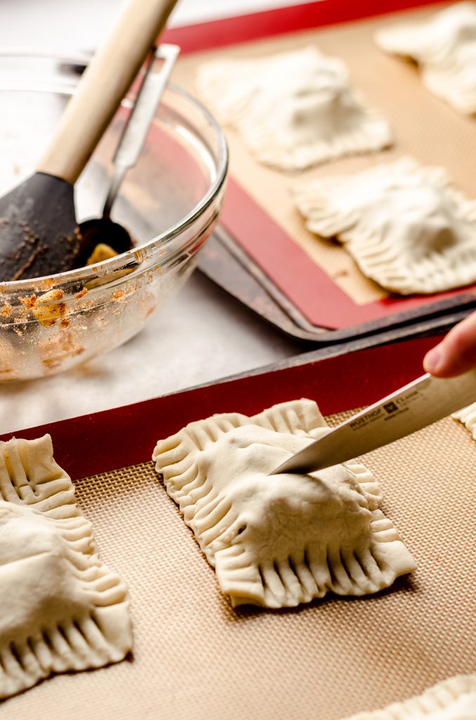 cutting slits into the top of apple hand pies