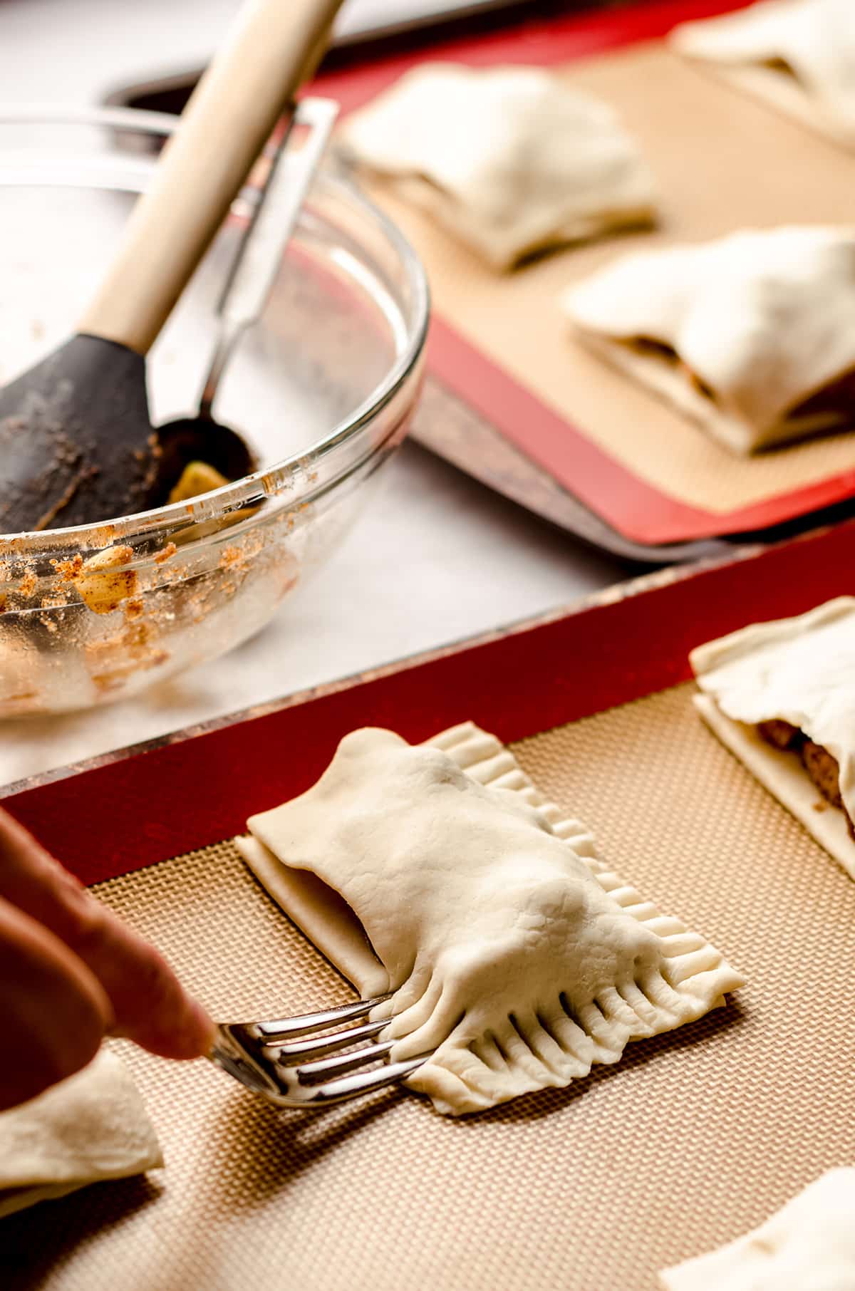 crimping apple hand pies shut with a fork