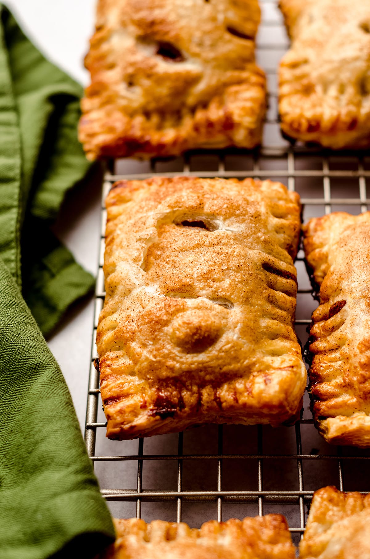 apple hand pies on a wire cooling rack