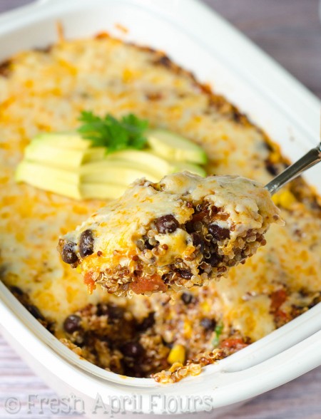 Cheesy Enchilada Quinoa Casserole: A quick, healthy, and gluten free enchilada casserole full of spicy flavors, lots of cheese, and nutrient-rich quinoa.