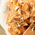Pumpkin Butterscotch Bark: An easy bark made with pumpkin spice candy melts, butterscotch chips, and chopped nuts. Great for Halloween goodie bags!