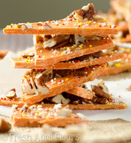 Pumpkin Butterscotch Bark: An easy bark made with pumpkin spice candy melts, butterscotch chips, and chopped nuts. Great for Halloween goodie bags!