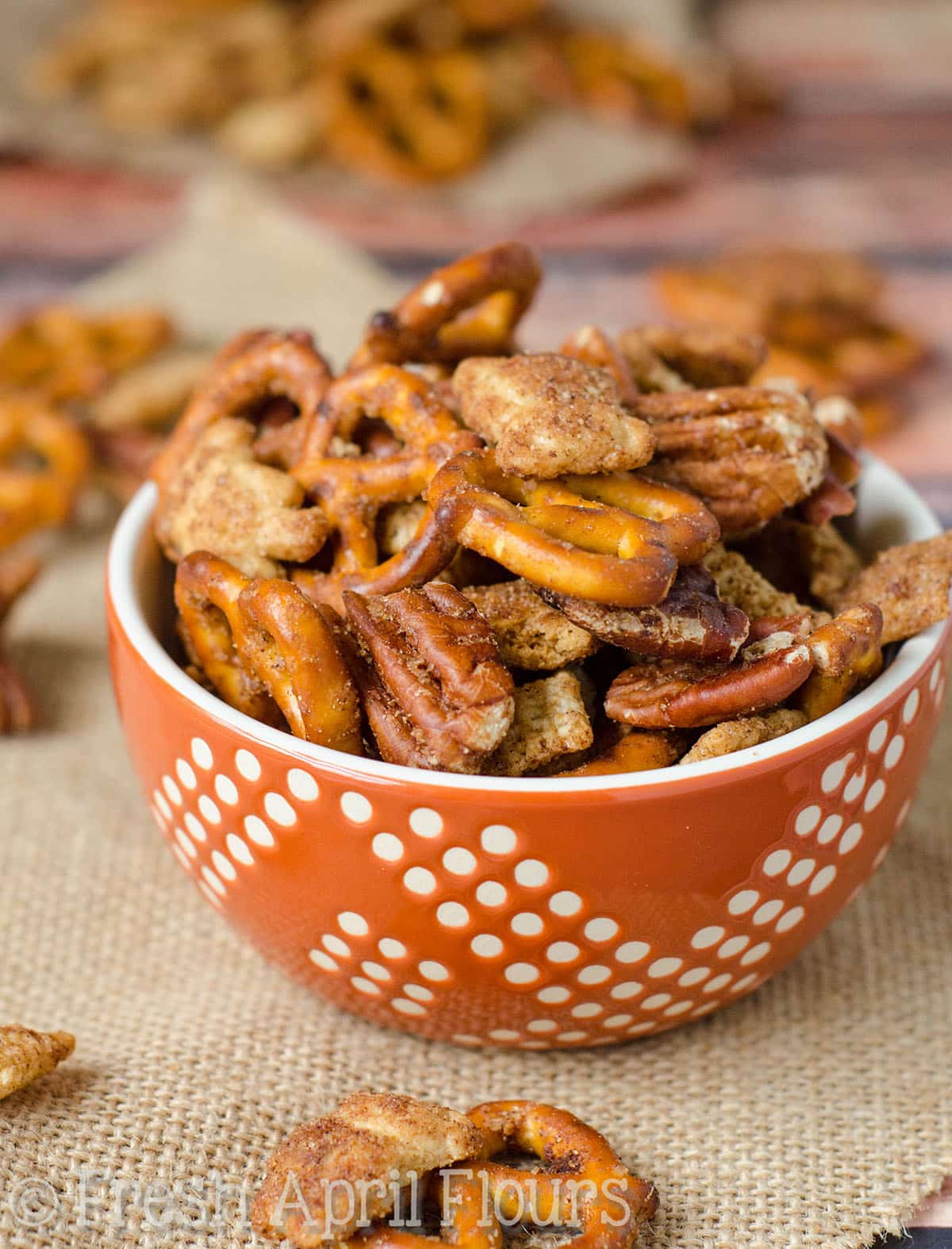 A bowl of pumpkin spice chex mix.