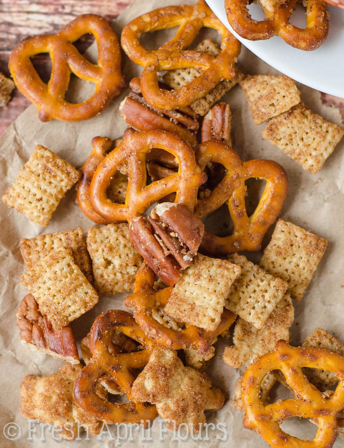 Pumpkin spice Chex mix on a surface.