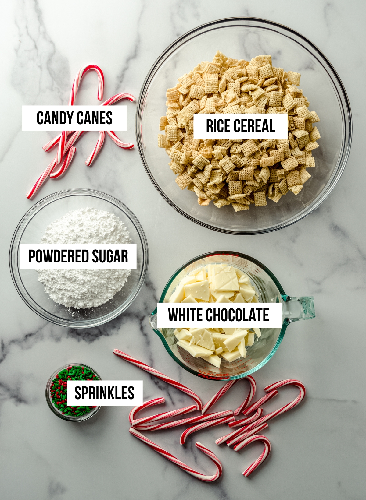 Aerial photo of ingredients for peppermint candy cane puppy chow with text overlay.