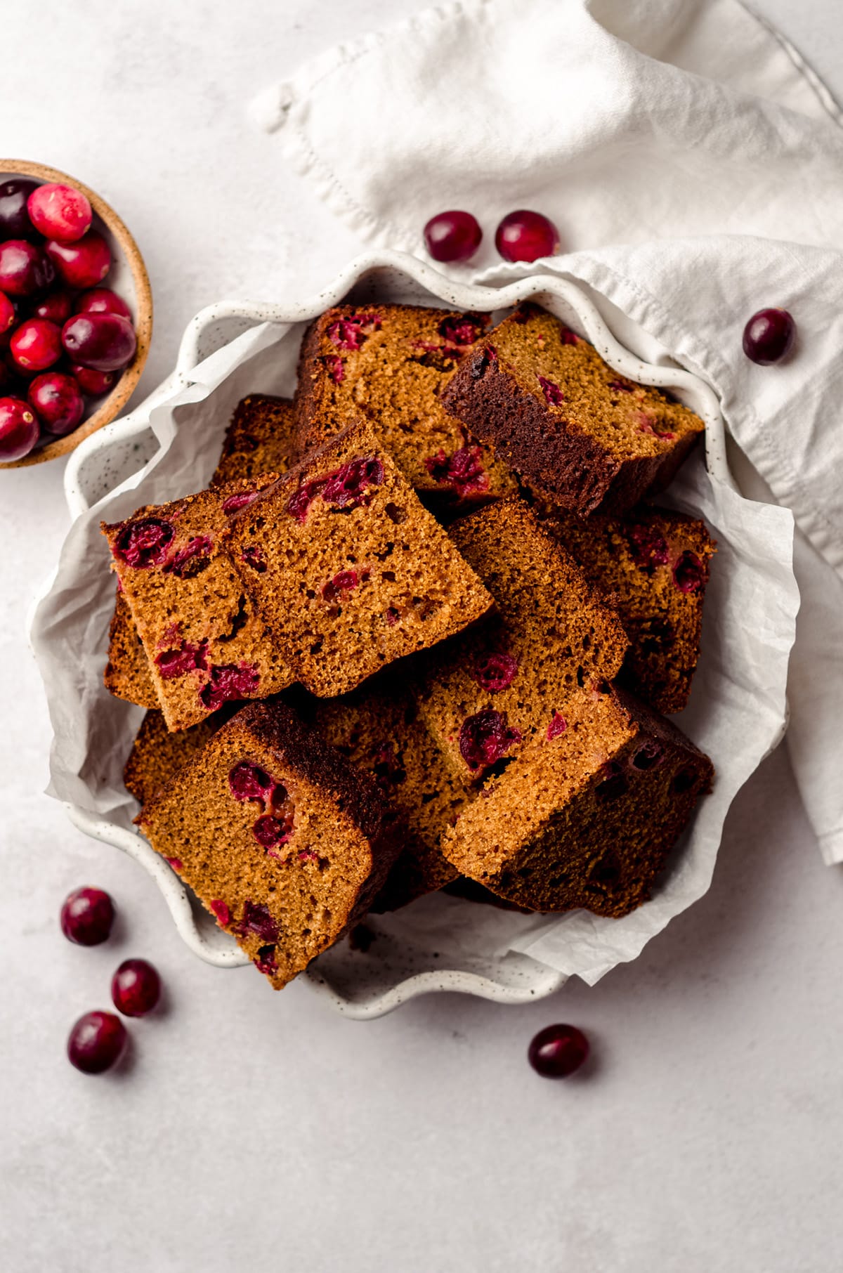 slices of cranberry gingerbread in a fluted plate