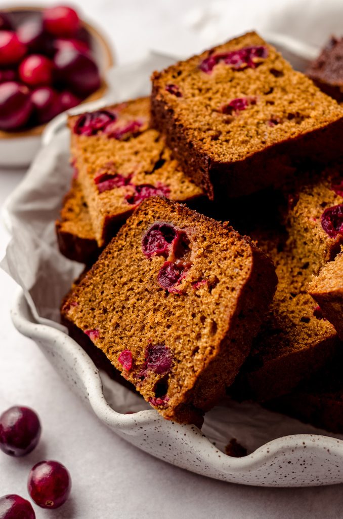 slices of cranberry gingerbread in a fluted plate