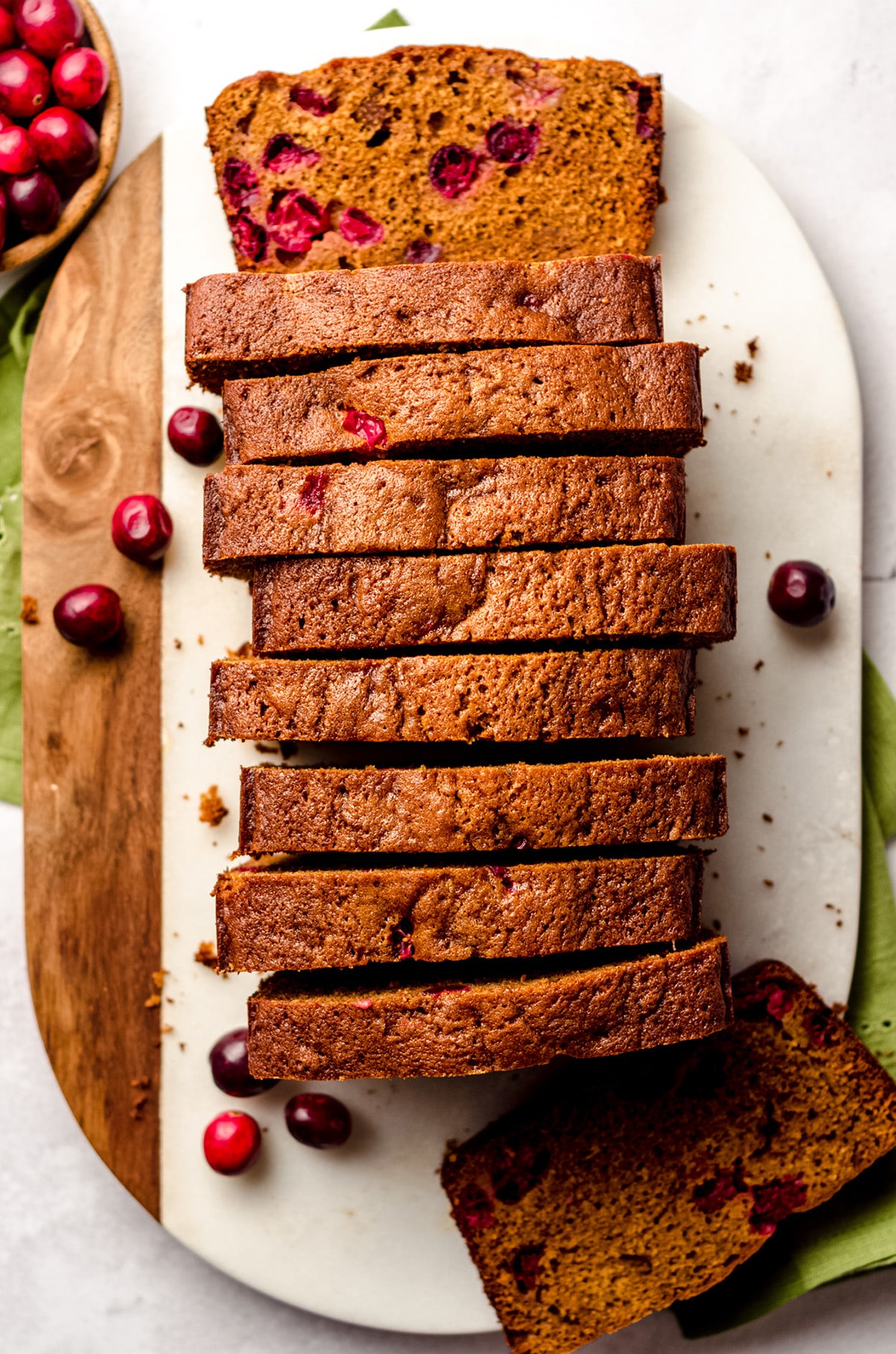 aerial photo of a loaf of cranberry gingerbread cut into slices