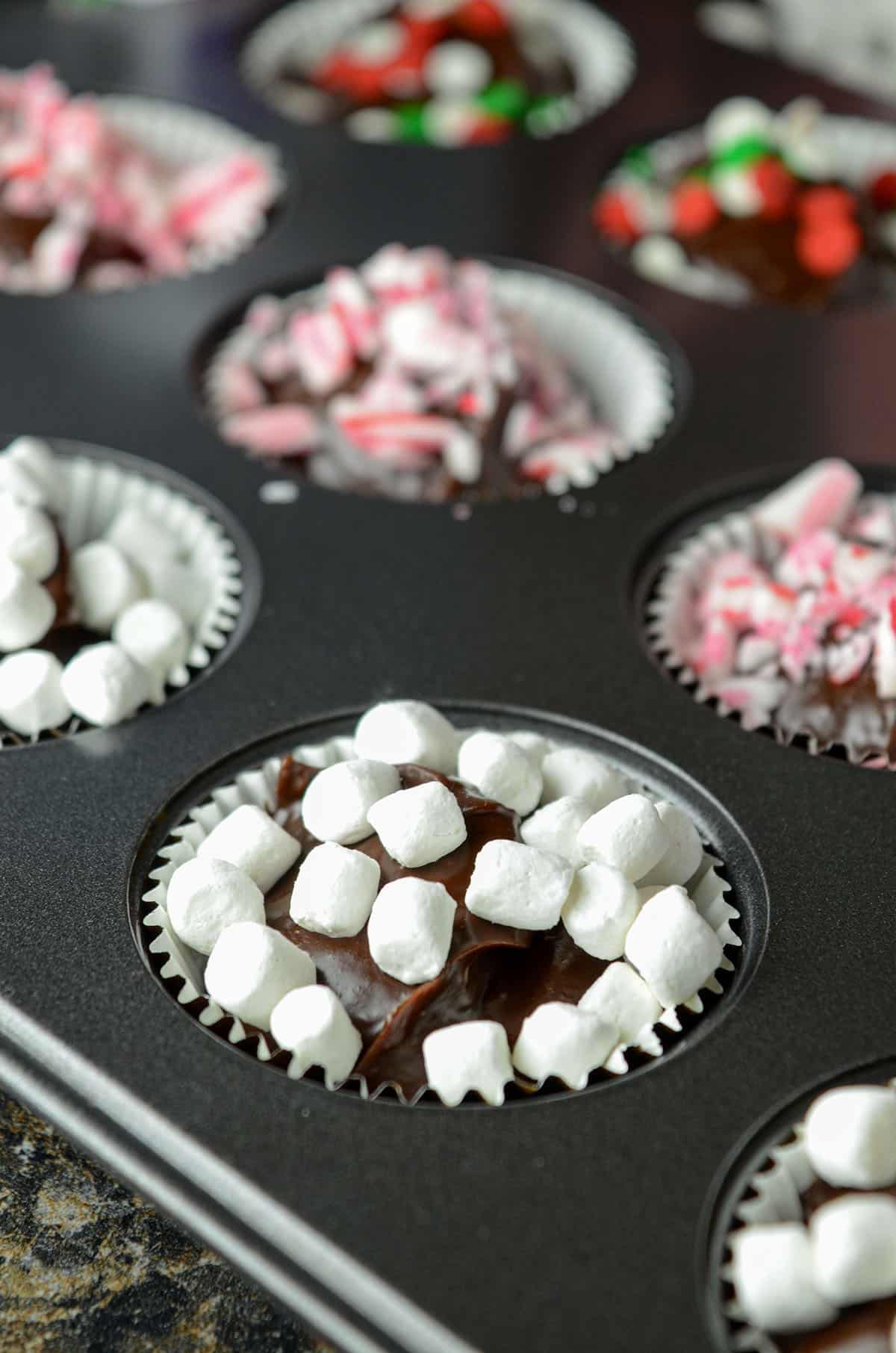 hot chocolate bombs sitting in mini-cupcake pan