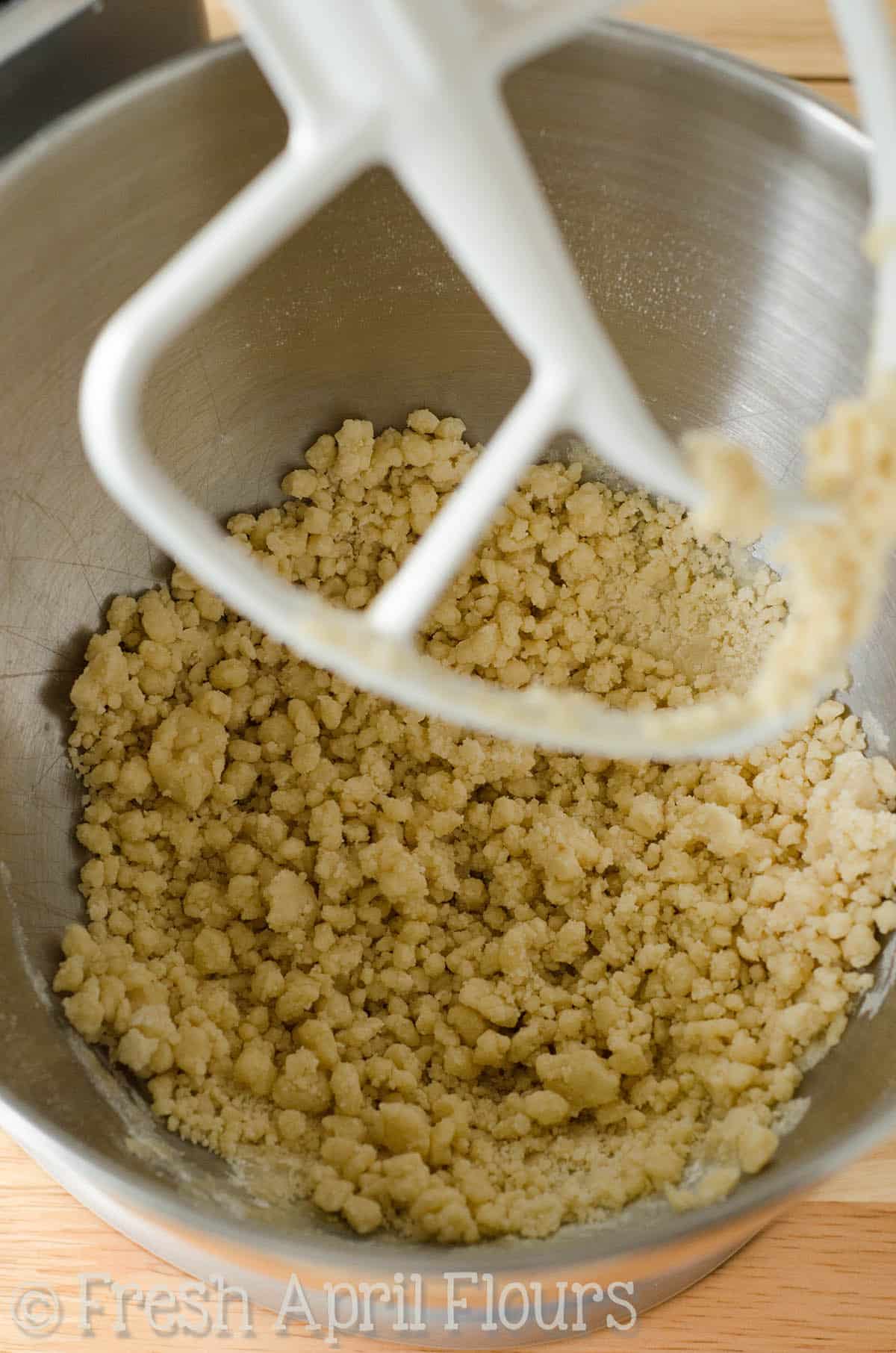 Dough for parmesan parsley bread in the bowl of a stand mixer.