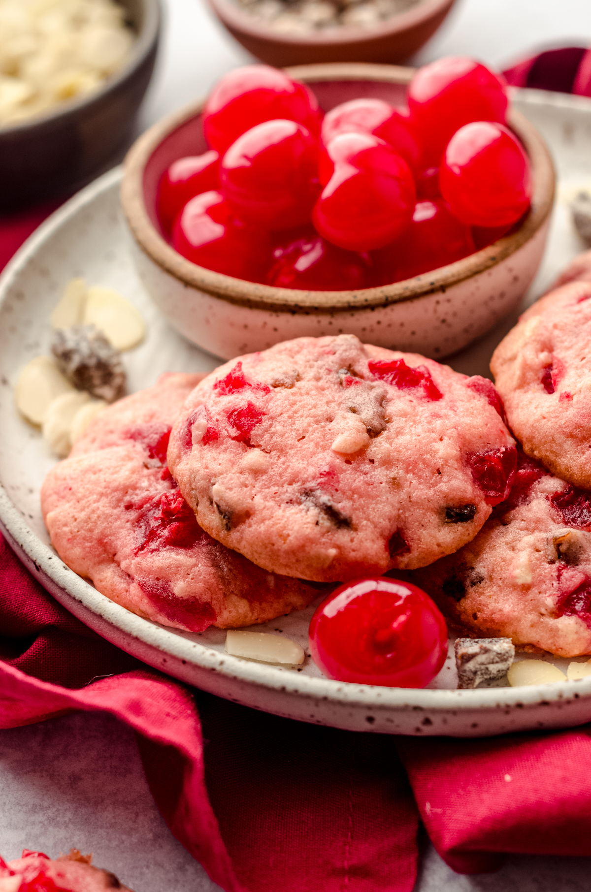 Cherry almond date cookies on a plate.