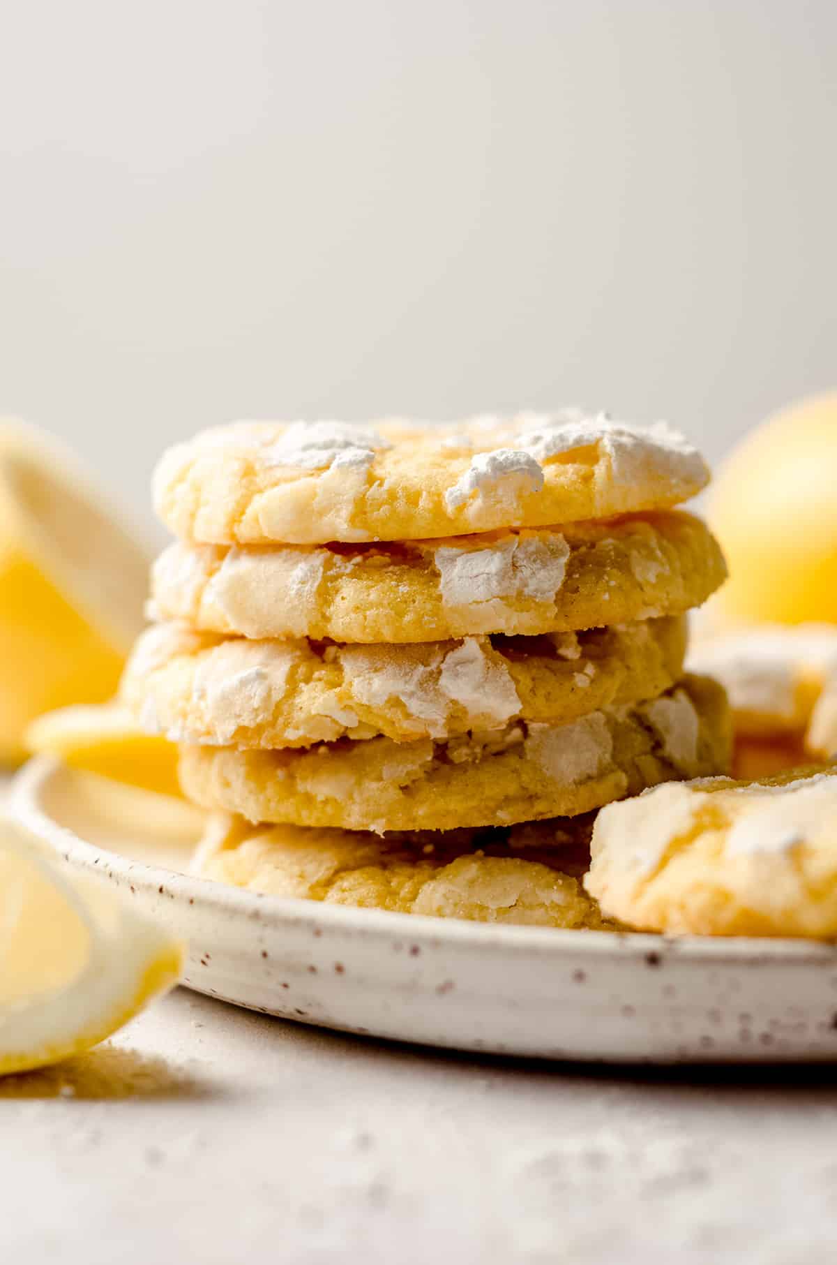 a stack of lemon crinkle cookies on a plate