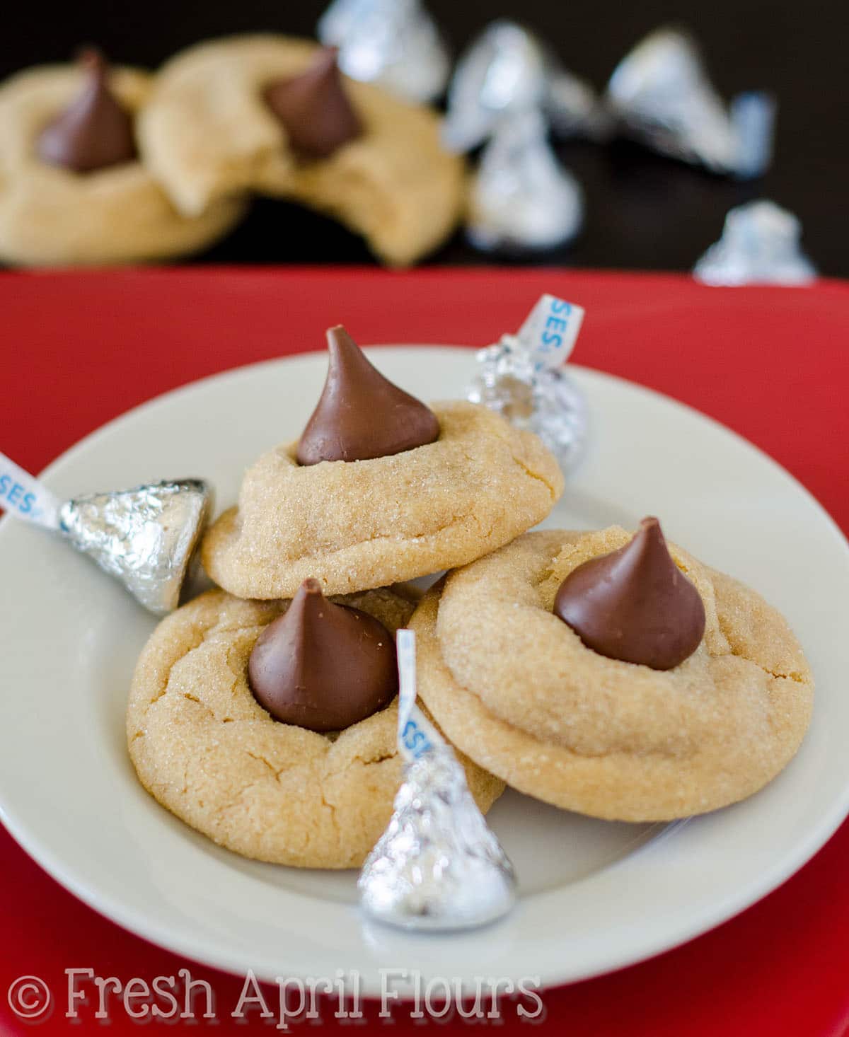 Peanut butter blossom cookies on a plate.