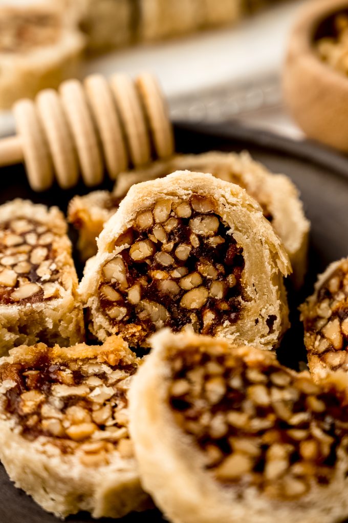 Honey walnut cookie stick slices (sfratti) on a plate.