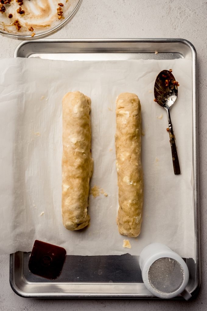 Aerial photo of honey walnut cookie sticks on a baking sheet.