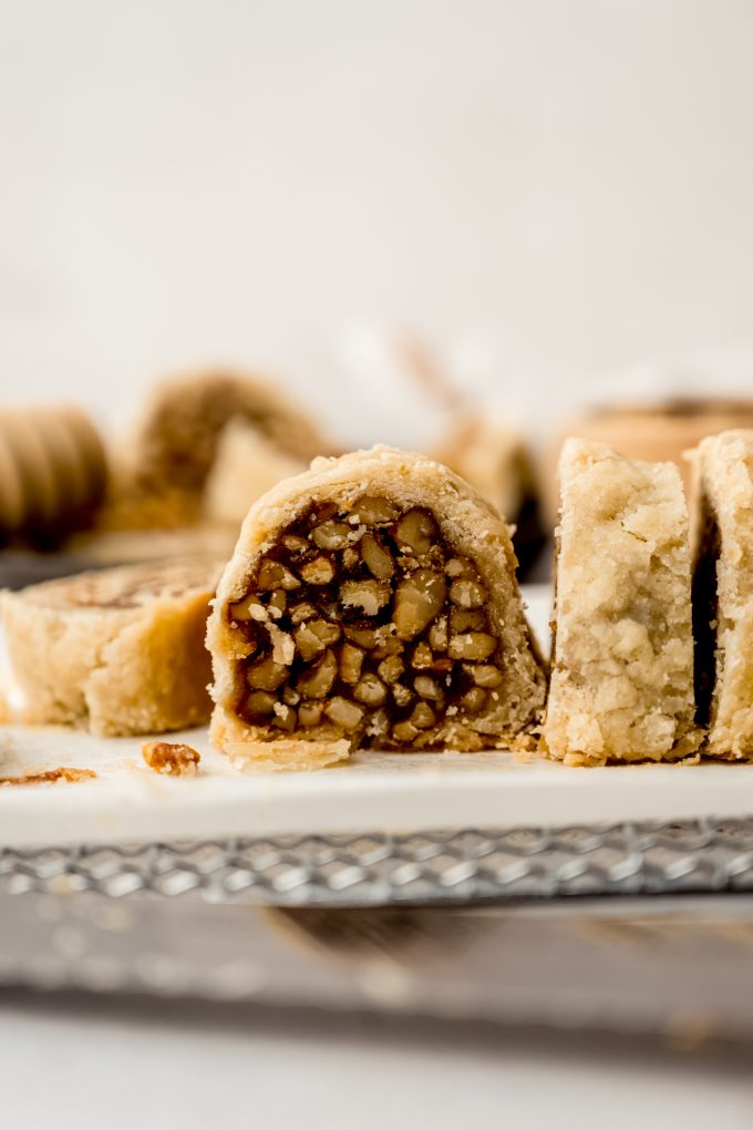 Honey walnut cookie stick slices (sfratti) on a cooling rack.