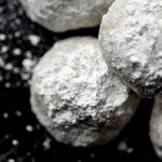 Aerial photo of a plate of snowball cookies.