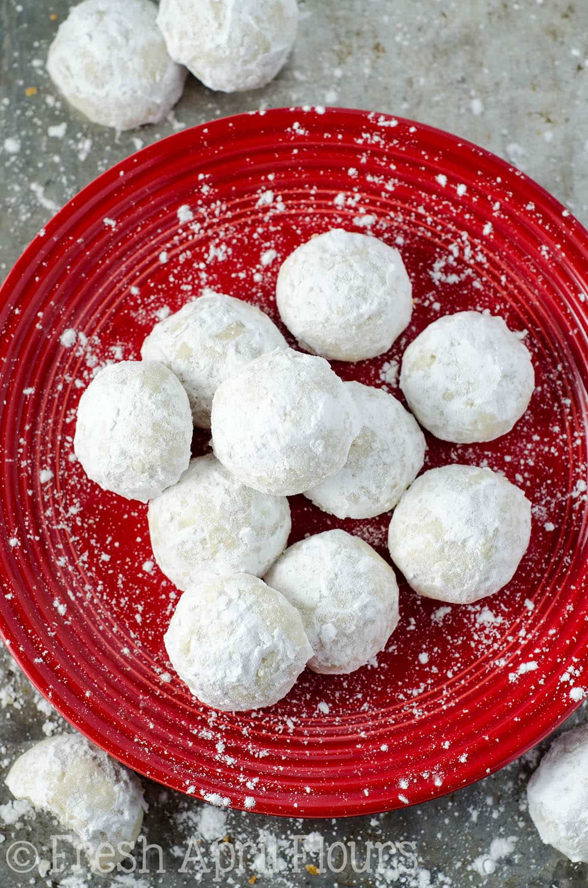 russian tea cakes on a red plate